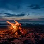 campifire on the beach at night MOSQUITRON